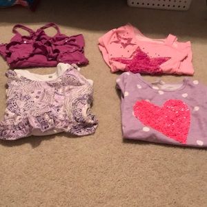 Pack of 4 T-shirts from different brands.